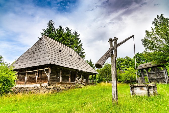 7-Days Grand Romania tour from Bucharest - Day 3: Barsana Monastery, the wood carvers, and Merry Cemetery humor