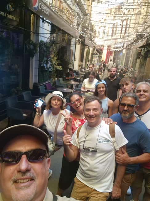 Bucharest: Walking tour with Italian speaking guide for small groups - Cărturești Carusel and the kind of side stops that make photos better