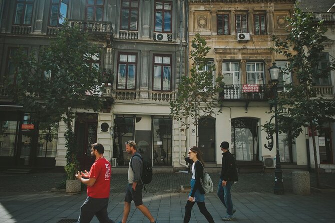 Discover Bucharest: Private Highlights and Traditional Food Tour - Revolution Square, plus the communist architecture that still dominates the view