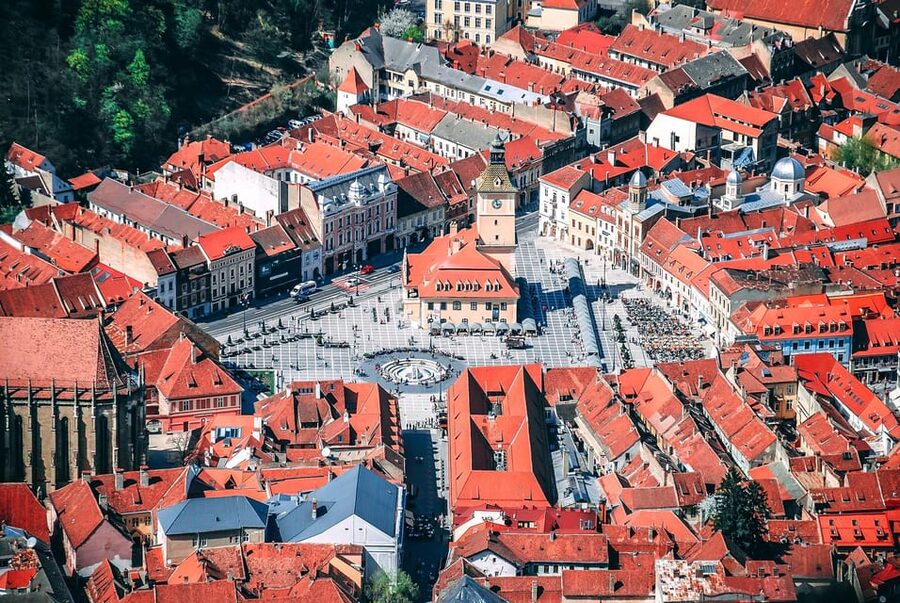Minivan 8 Places : Dracula Castle, Peles, & Brasov Day Tour - Brasov medieval streets: Black Church, Council Square, and mountain scenery