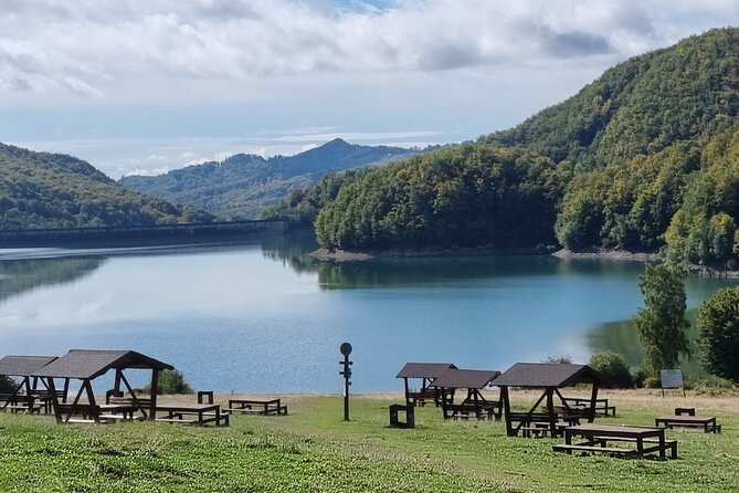 Private Day Tour to Historical Villages in Sinaia - Izvorul Alb: cottages, a village square moment, and a quick snack stop